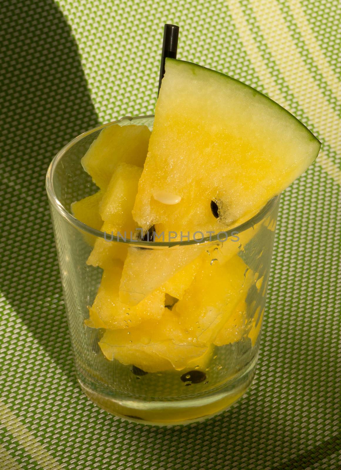 Yellow watermelon in a glass with slices and wedges for Watermelon diet
