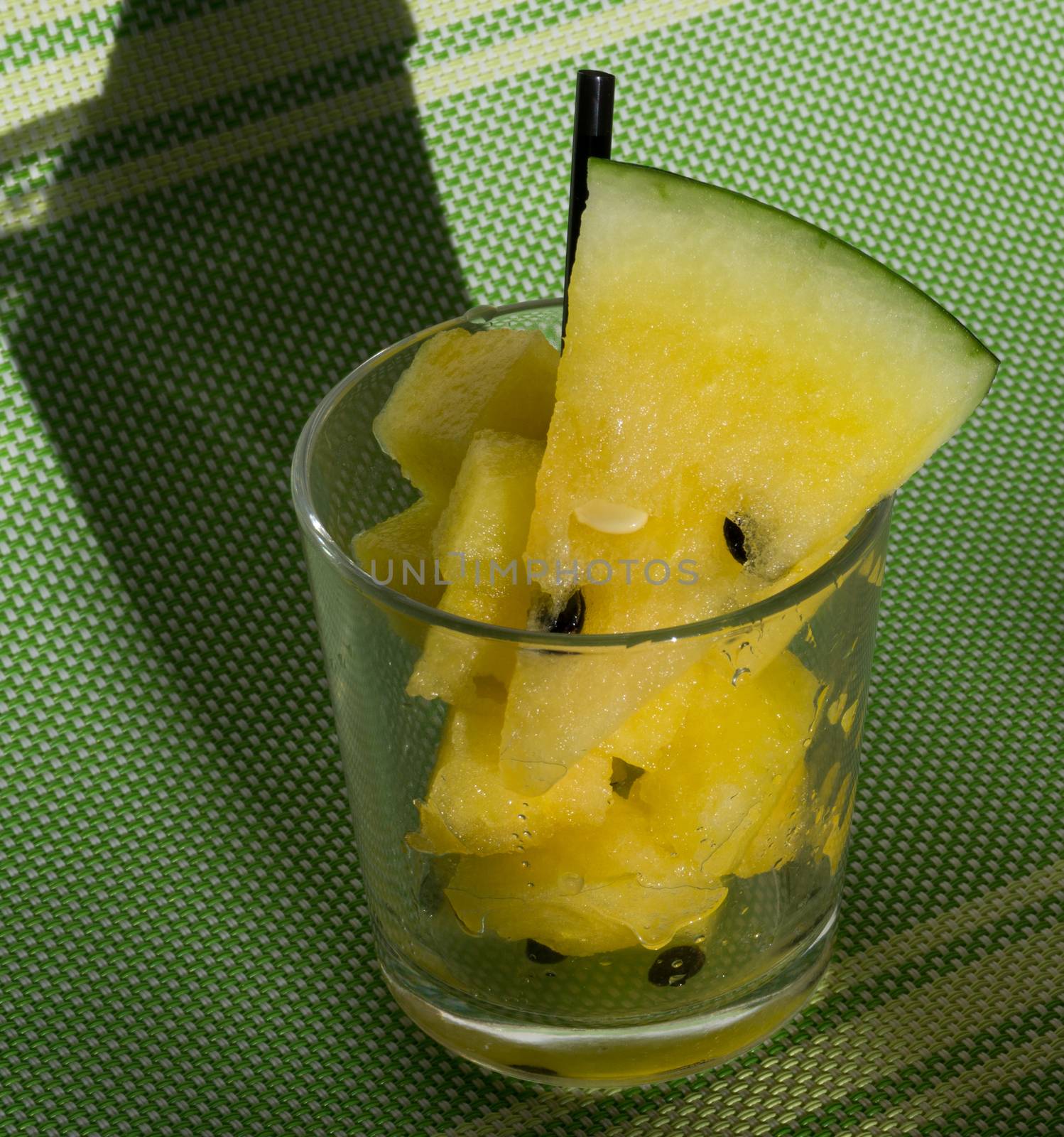 Yellow watermelon in a glass with slices and wedges for Watermelon diet