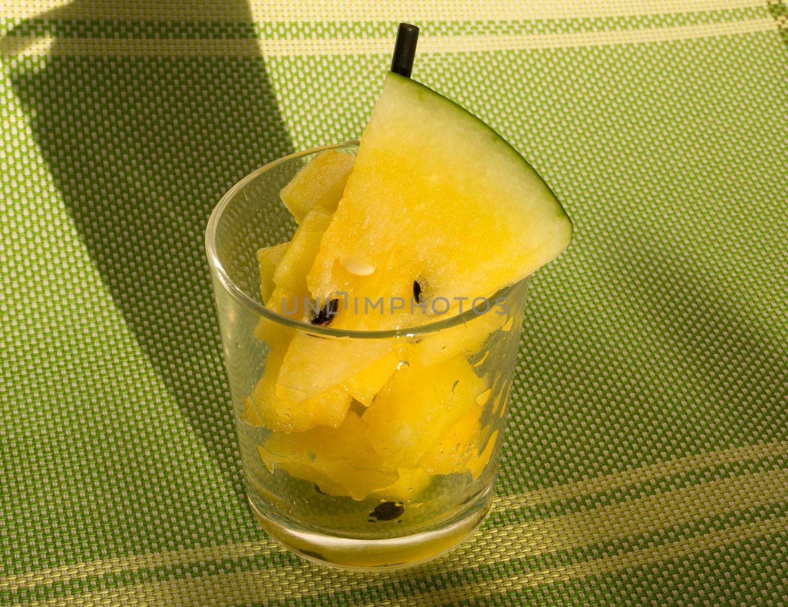 Yellow watermelon in a glass with slices and wedges for Watermelon diet