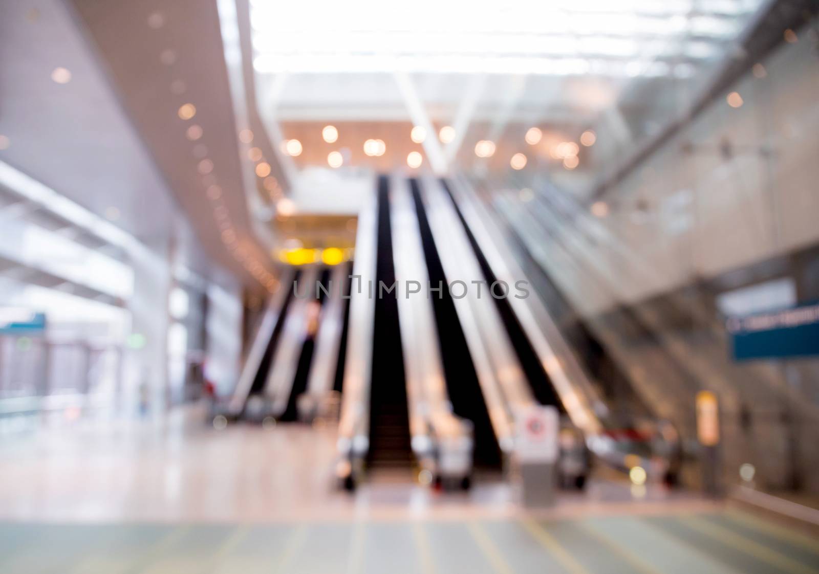 blur background of escalator at the airport for use.