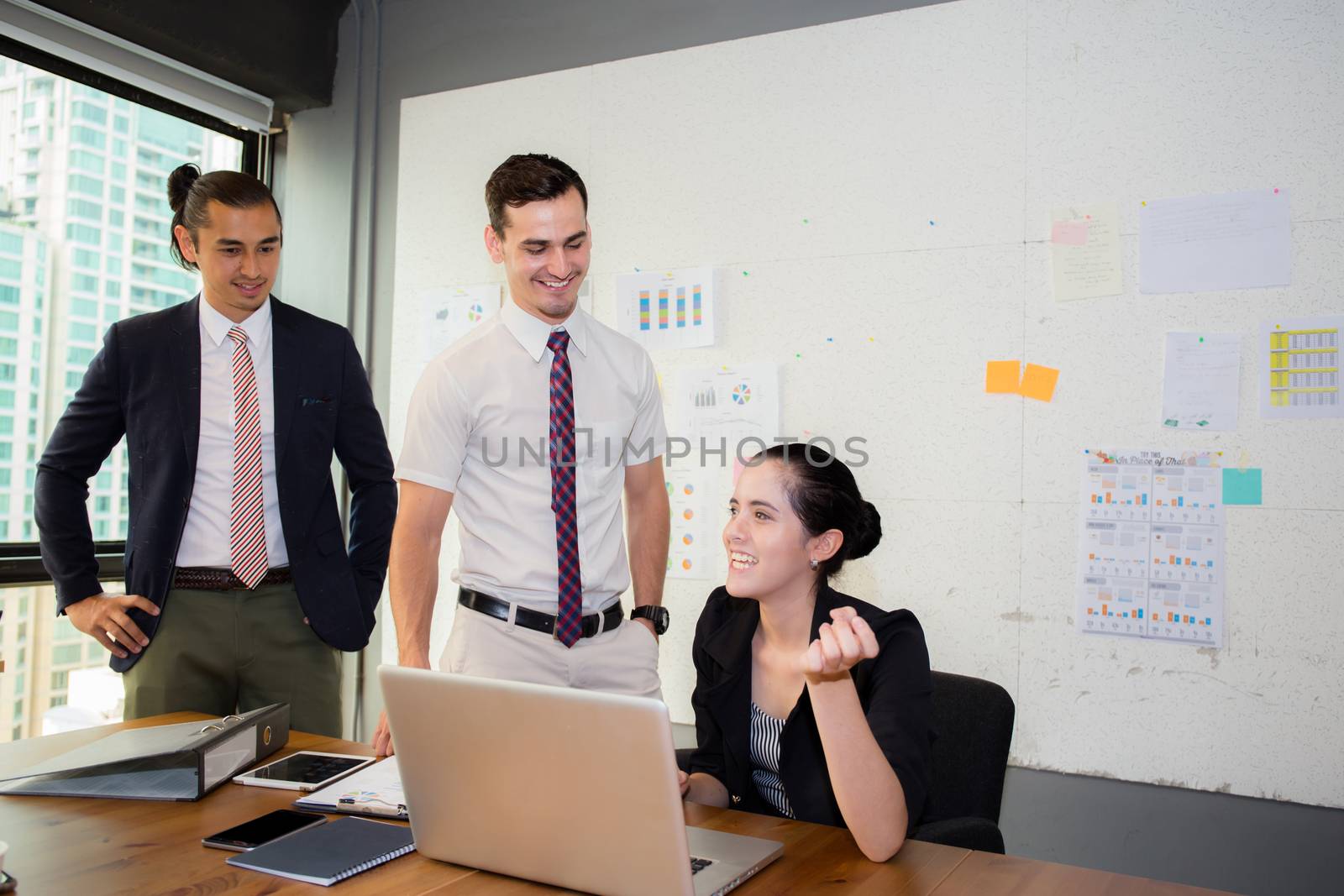 Business team having using laptop during a meeting and presents.