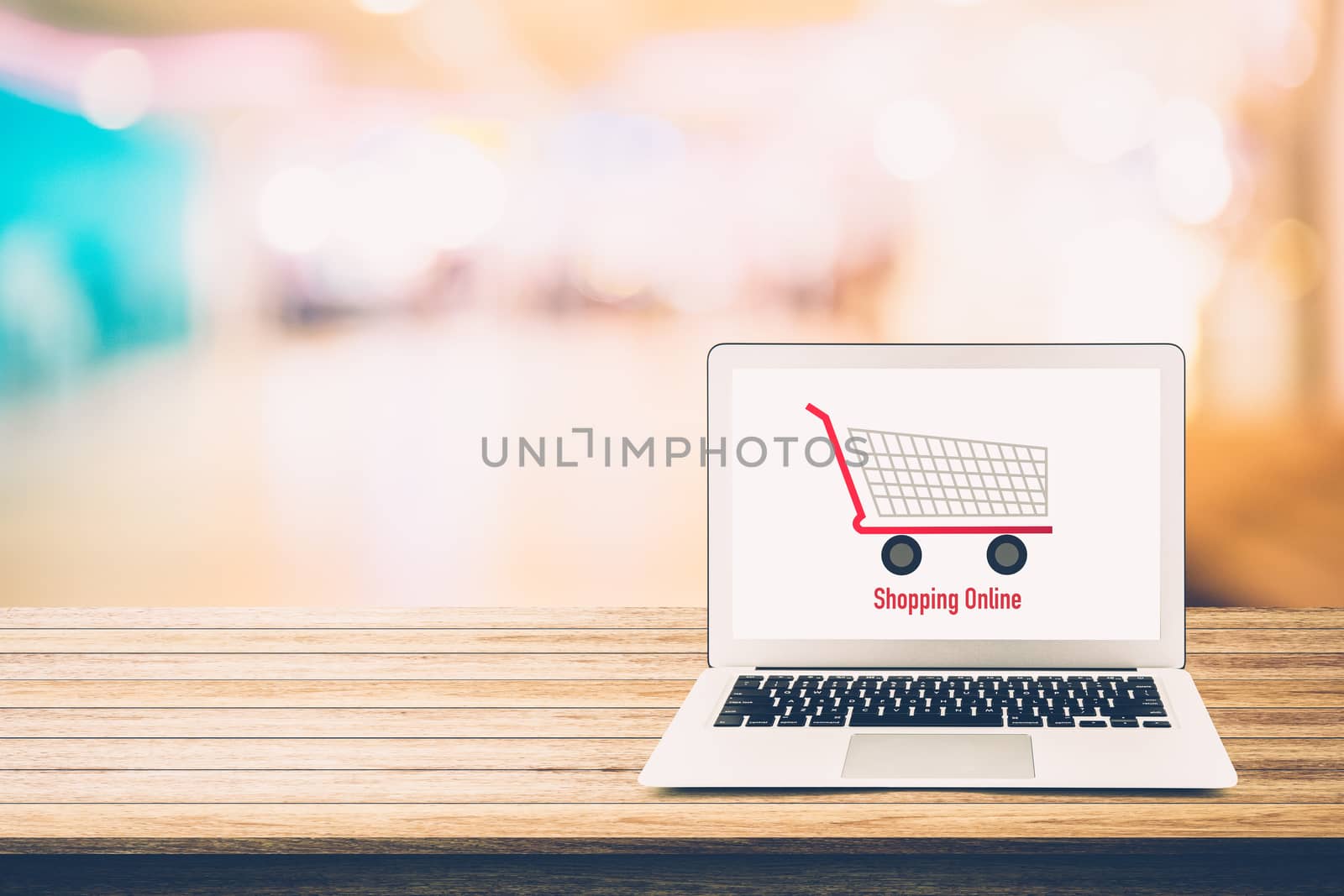 shopping online with labtop, notebook on table top and bokeh background, shop with computer.
