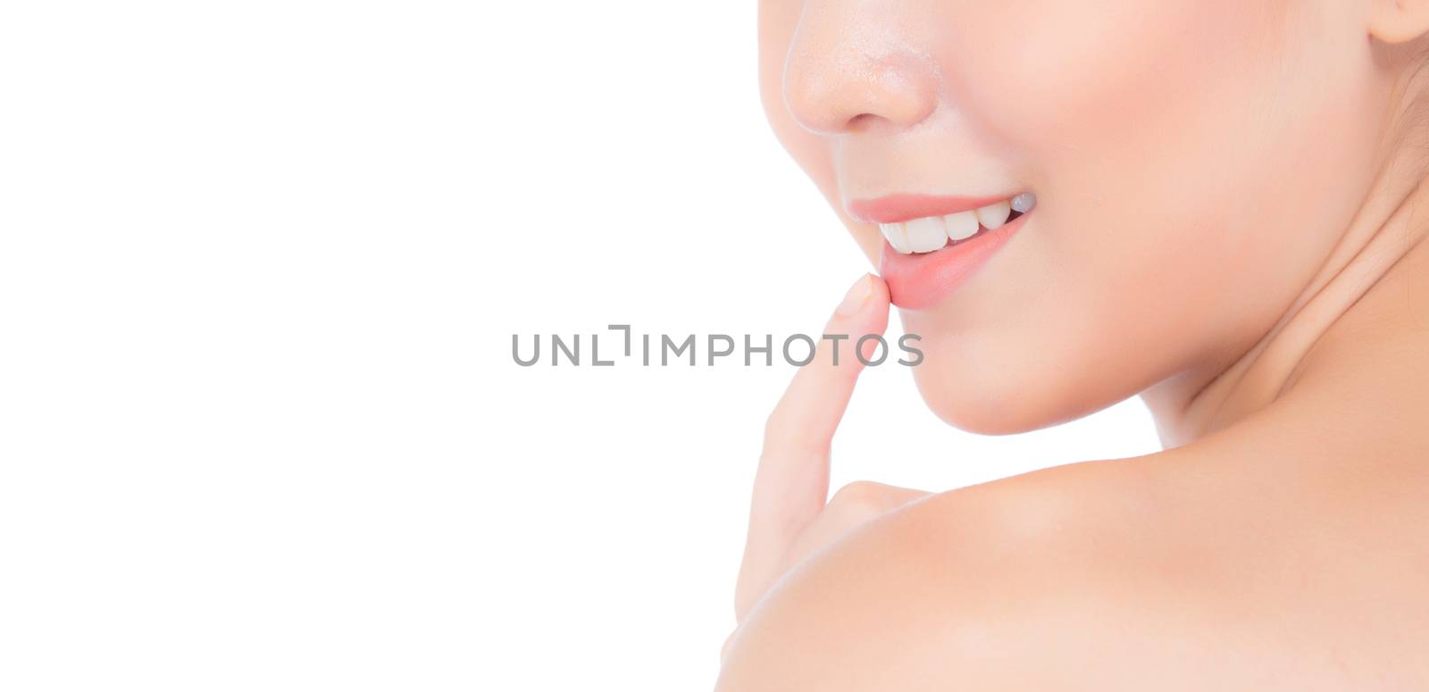 Beauty asian young woman with clean fresh skin touch lips. Cosmetic, beauty and spa concept. Model hold a finger to mouth.