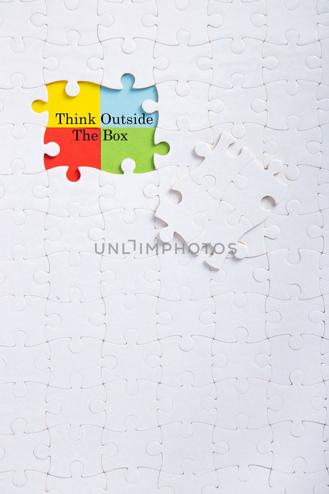 Jigsaw puzzle piece with word think outside the box by tehcheesiong