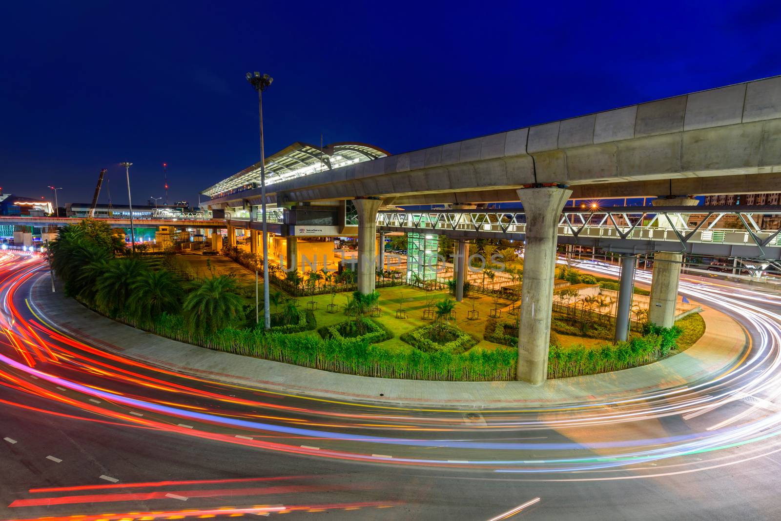 High view Blur light of traffic car at Wat Phra Sri  Mahatat BTS Station by rukawajung