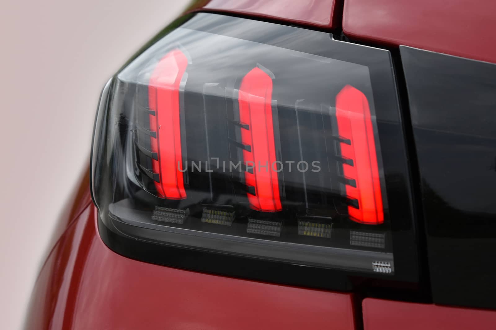 The tail lights on a luxury passenger car by aselsa