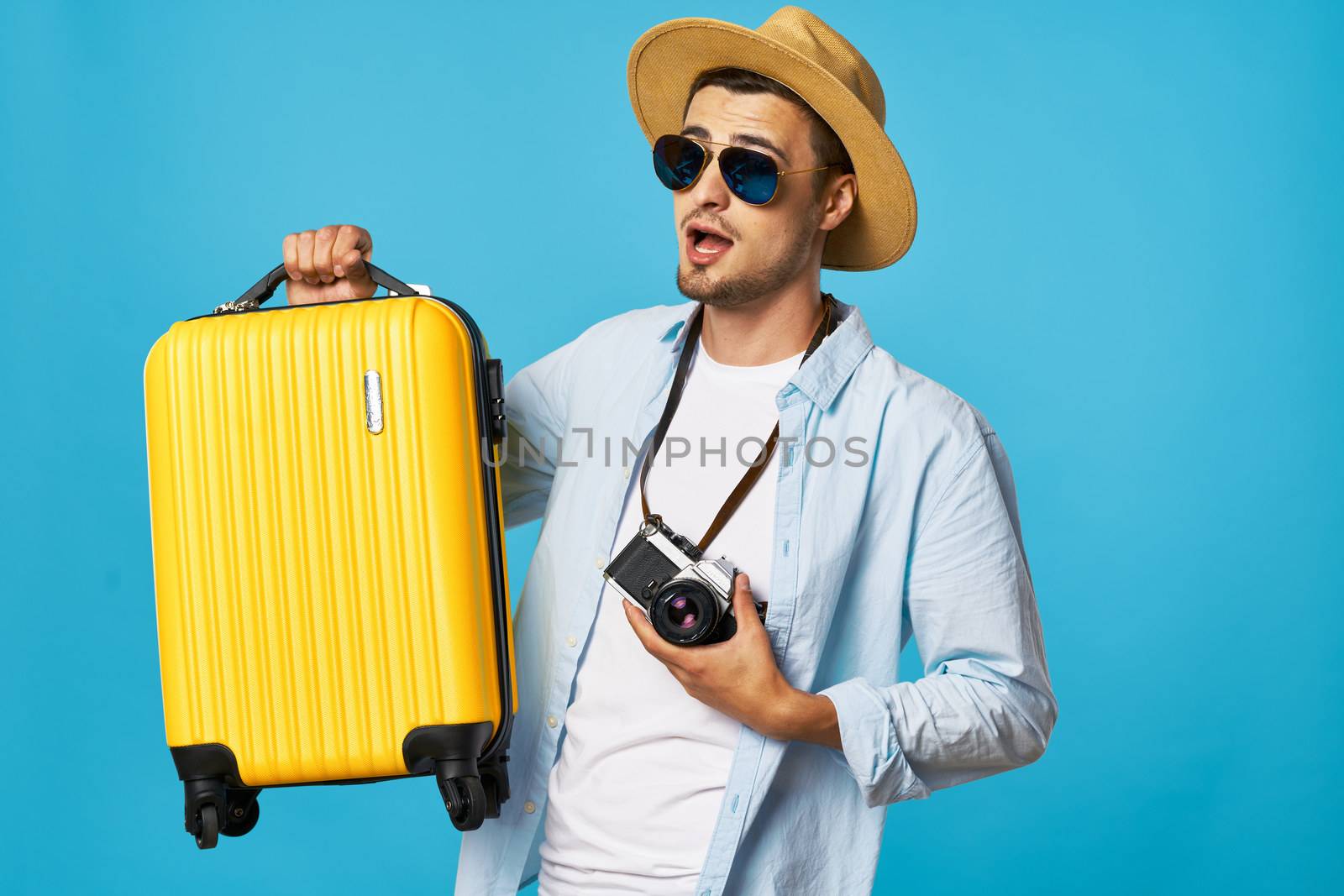 Male tourist with camera luggage passenger airport by SHOTPRIME