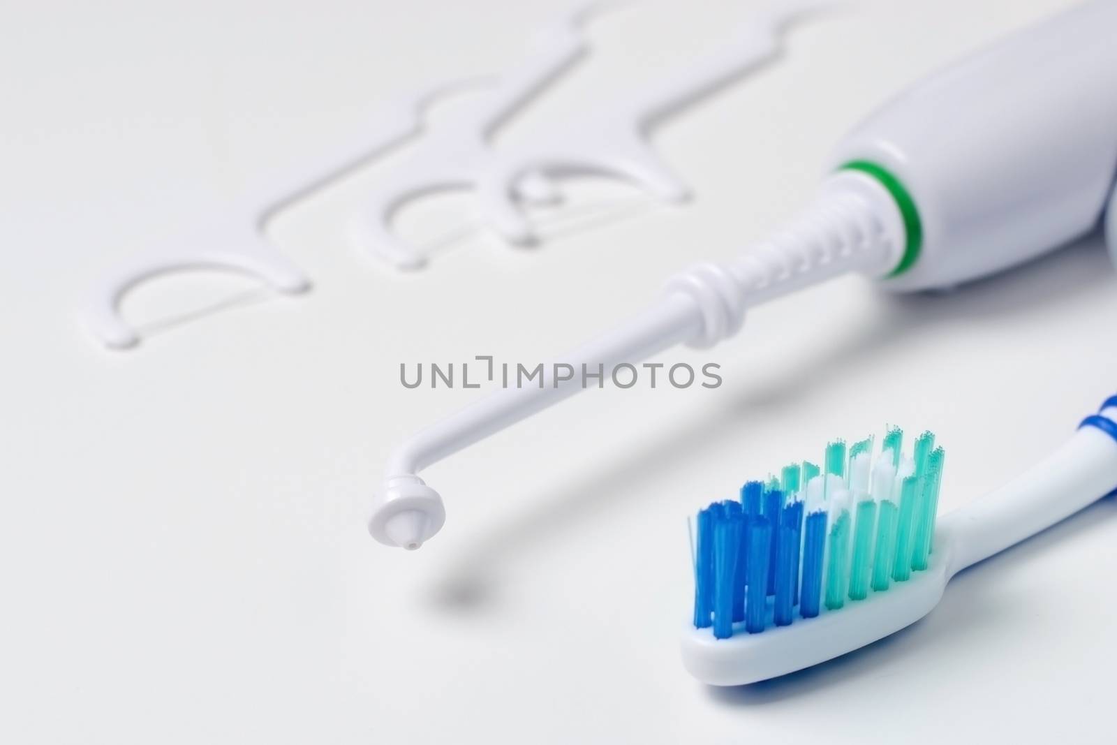 Toothbrush, tartar removal device, and floss on a white background by balage941