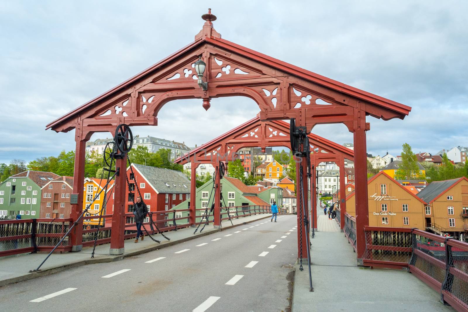 Trondheim, Norway, May 2015: Old Bridge (Norwegian: Gamle Bybru) with historical wooden gate, crosing river Nidelva in Trondheim, Norway.