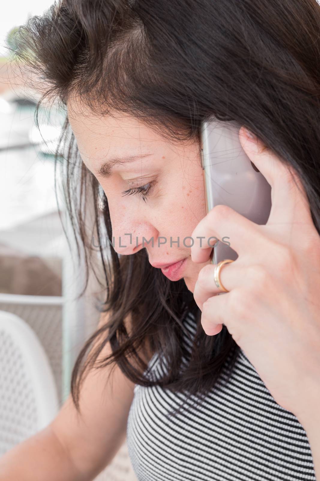 Beautiful business woman speaks by phone in the outdoor