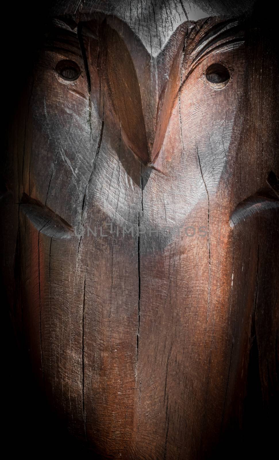 Carved wooden surface with the image of an owl
