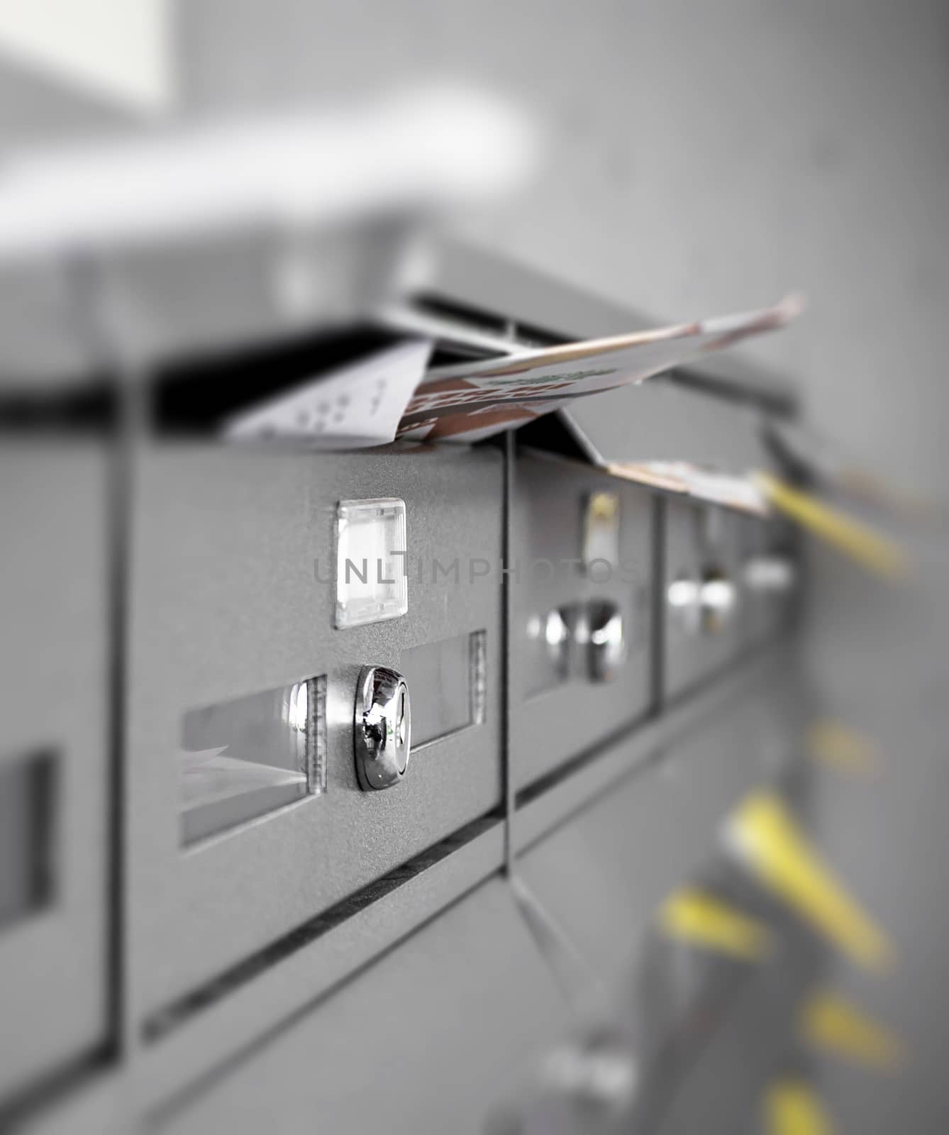 Mail boxes filled of leaflets and letters. Junk mail. Ideal for concepts.