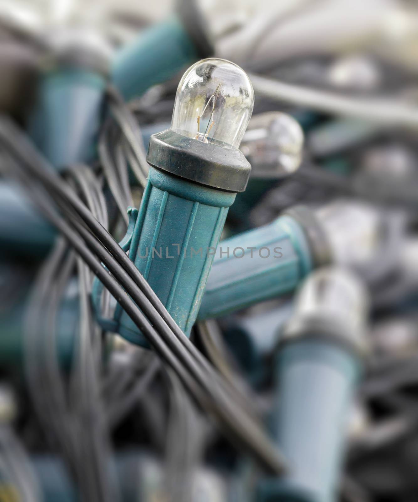 Mess of tangled old-style Christmas lights. Close-up.