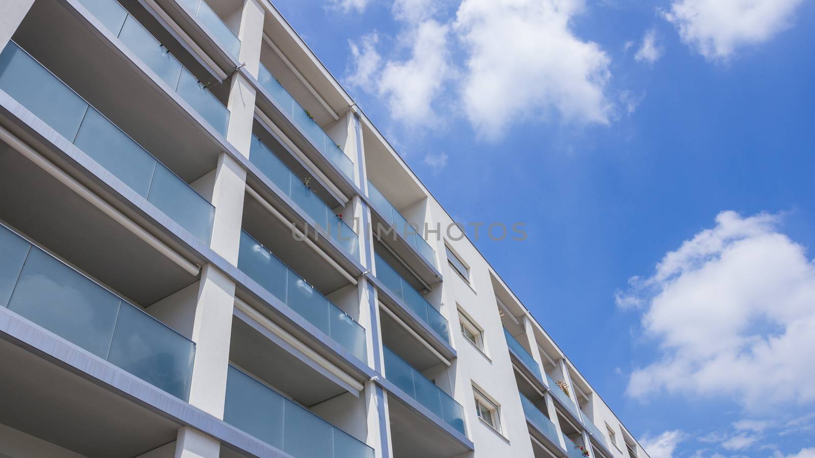 Modern apartment buildingn on a sunny day with a blue sky. Facade of a new apartment building.