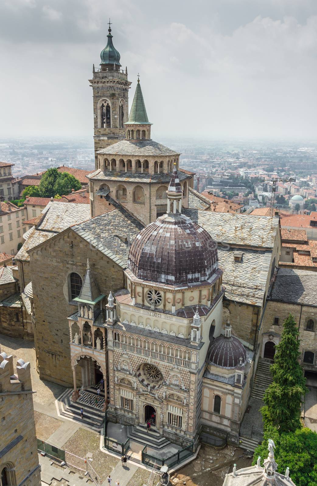 Basilica of Santa Maria Maggiore. Aerial view. In the background the lower town. Bergamo (upper town), ITALY - July 13, 2018.