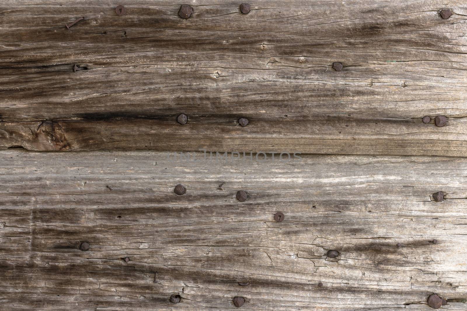 Old panel wood with rusty nails.