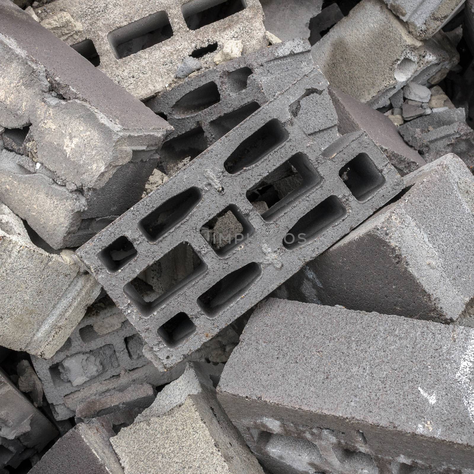 A mountain of concrete bricks arranged in bulk.