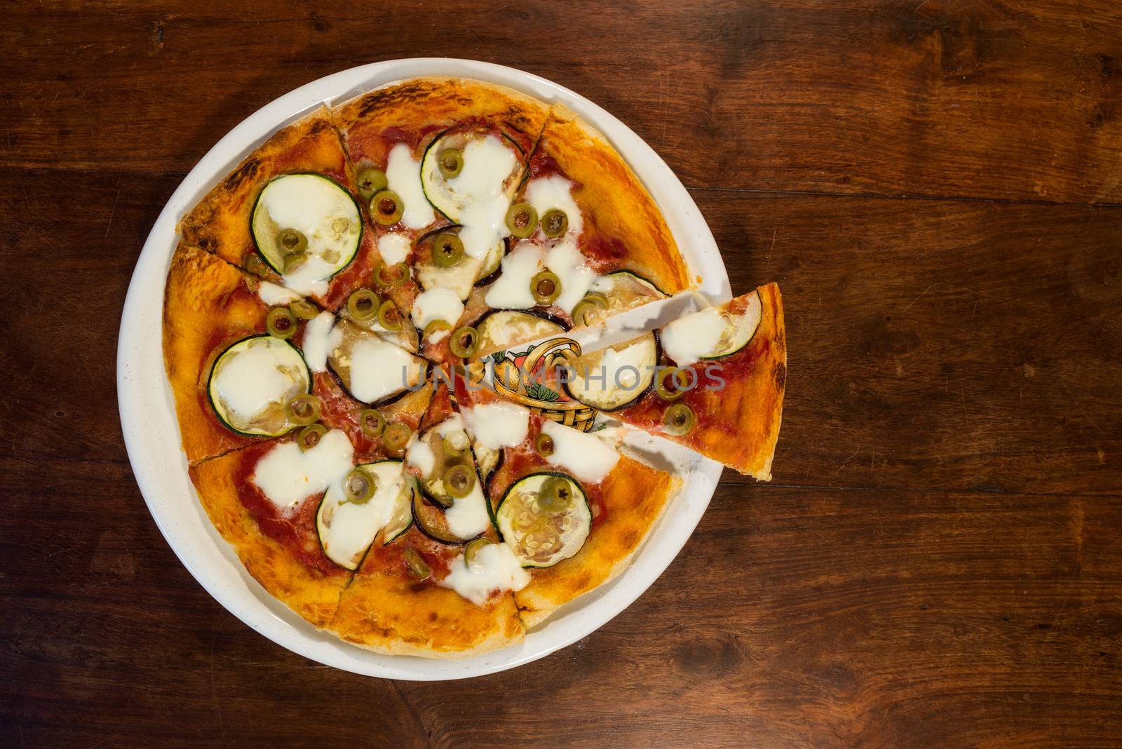 Italian pizza with zucchini, eggplant and green olives by LuigiMorbidelli