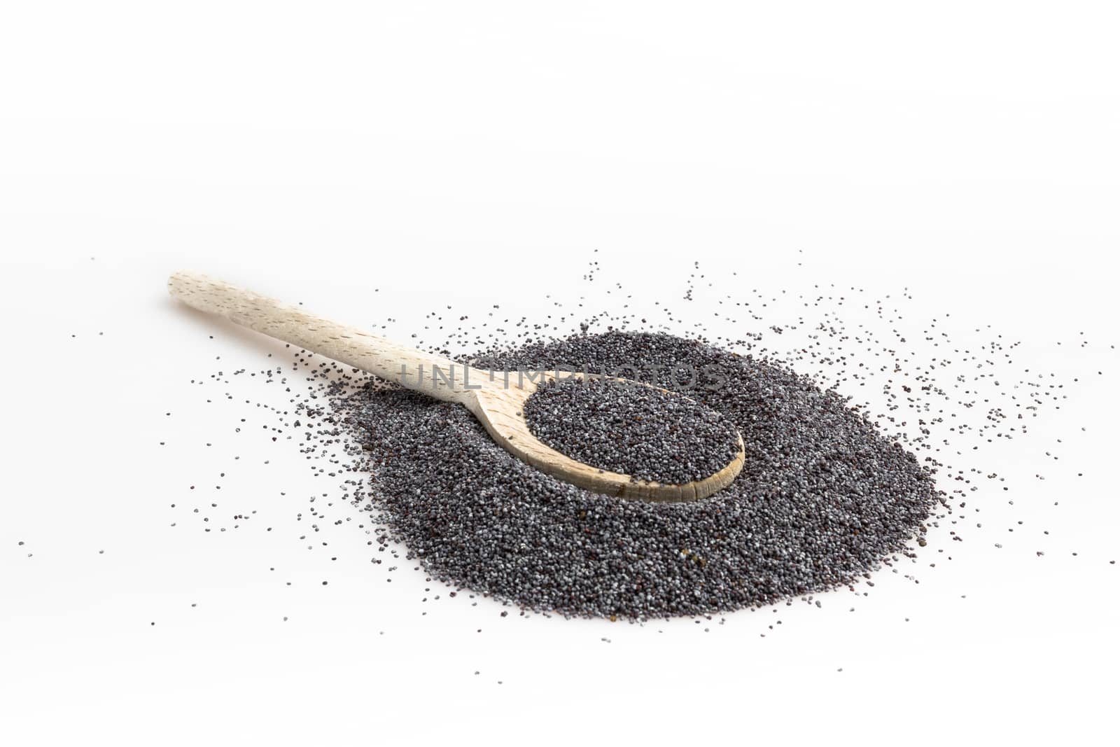 Poppy seeds in spoon isolated on white