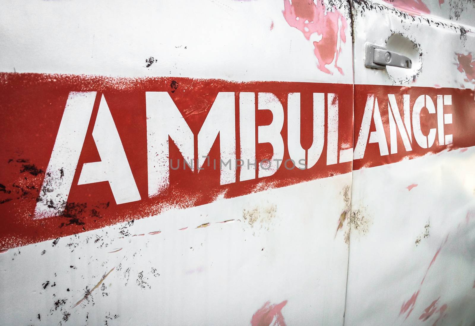 Masha and the Bear ambulance. Reproduction of the vehicle of the original animated series. Details of the characteristic rusty side panel. Bergamo, ITALY - August 28, 2017.