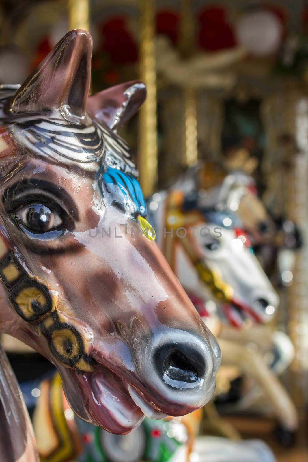 Extreme close-up of a toy horse on an old carousel.