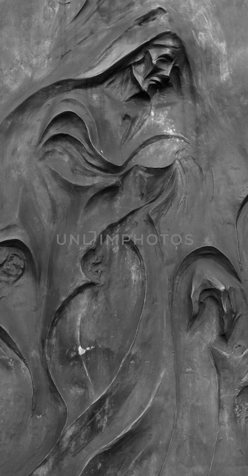 Sculpture depicting Death, in an Italian cemetery.