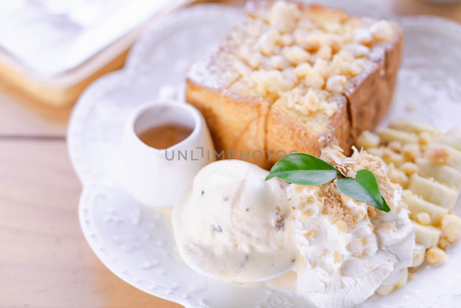 Honey toast dessert with ice coffee on wood table, top view by pt.pongsak@gmail.com