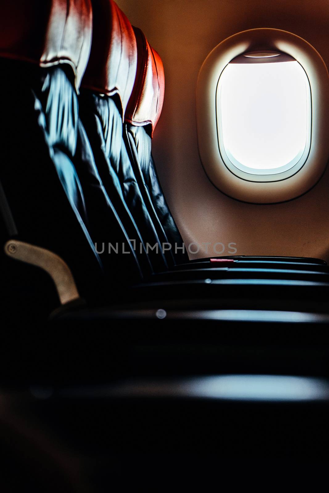 Seats in economy class section of airplane by ponsulak