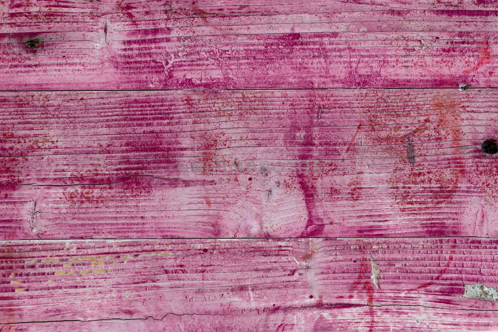 Background consisting of wooden planks painted pink.