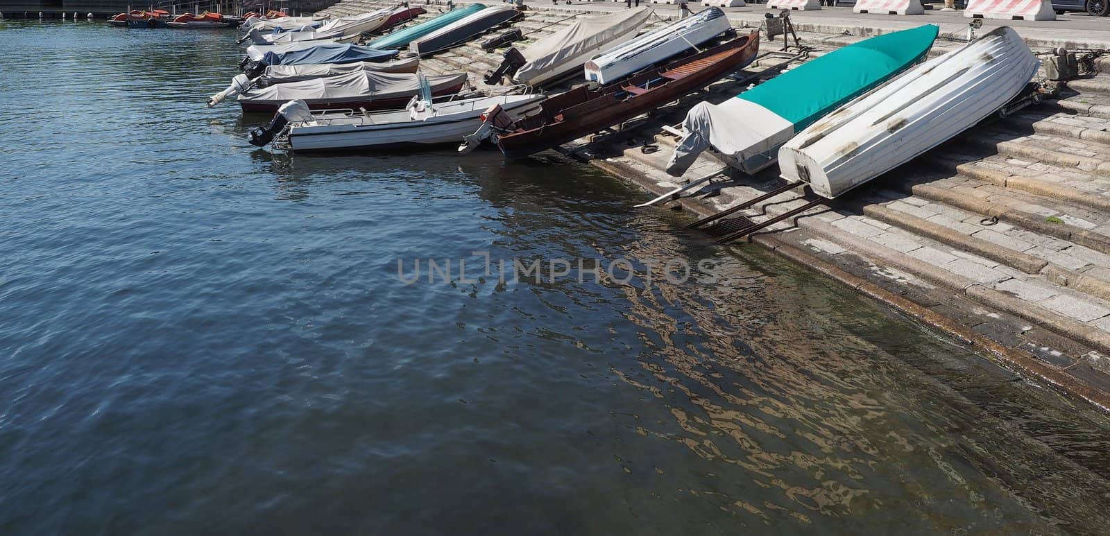 boats on the shore line by claudiodivizia