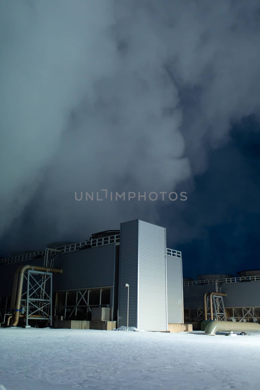 Night view. Thermal power plant building at a hot spring. Icelandic industry.