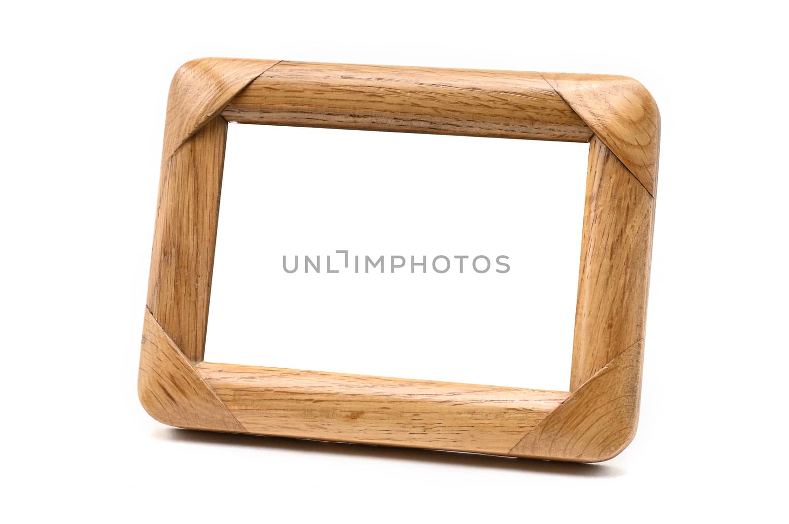 Antique wooden photo frame on an isolated white background by moviephoto