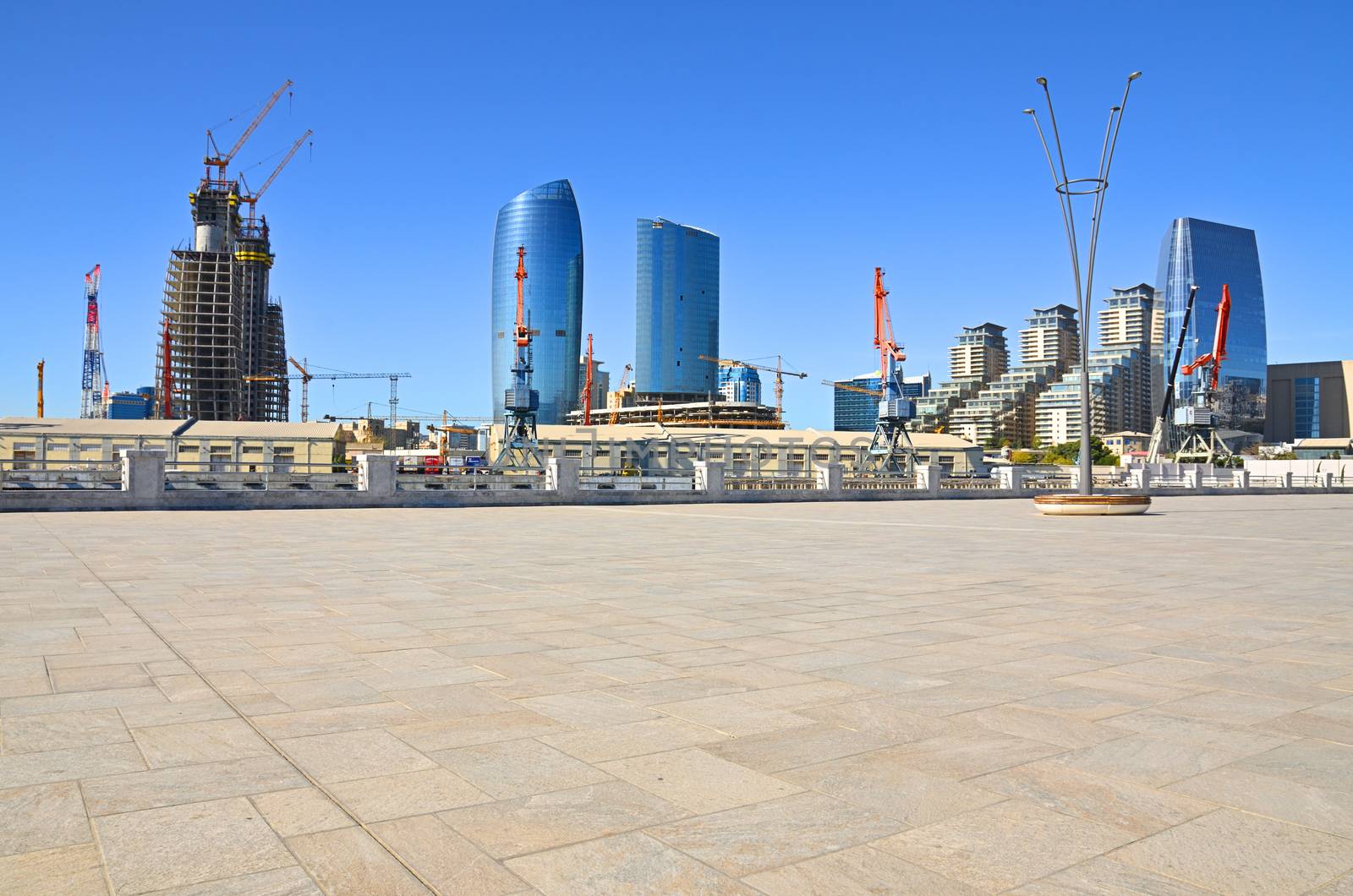 Views on parts of the city and architecture from the shores of the Caspian Sea in Baku.Port of Baku and buildings under construction.Azerbaijan