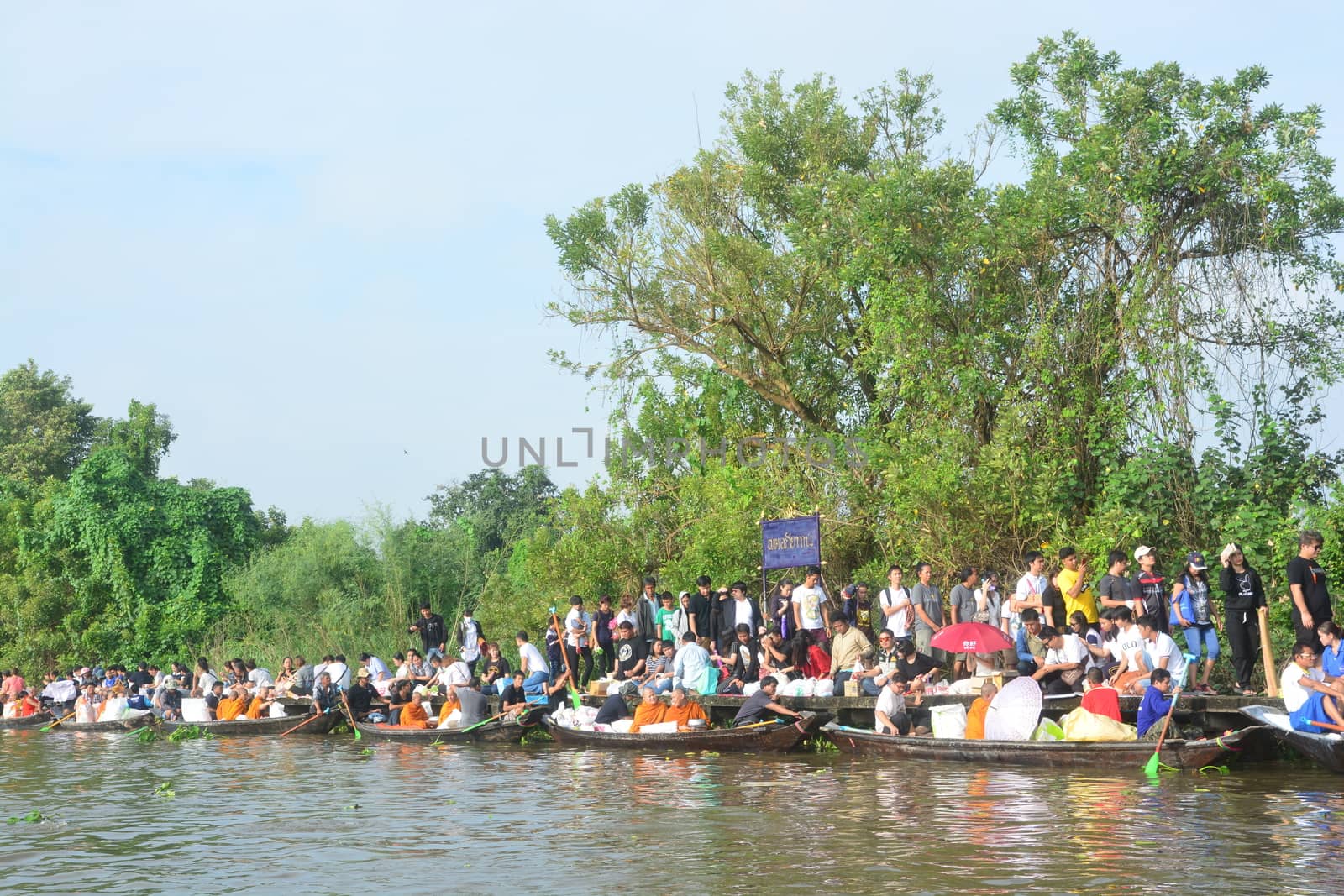 BANGKOK, THAILAND – OCTOBER 8, 2017 : Tuk baat Phra Roi River Festival (Give alms to a Buddhist monk on boat) On the Lamplatiew Canal in front of Wat Sutthaphot, Lat Krabang District Bangkok