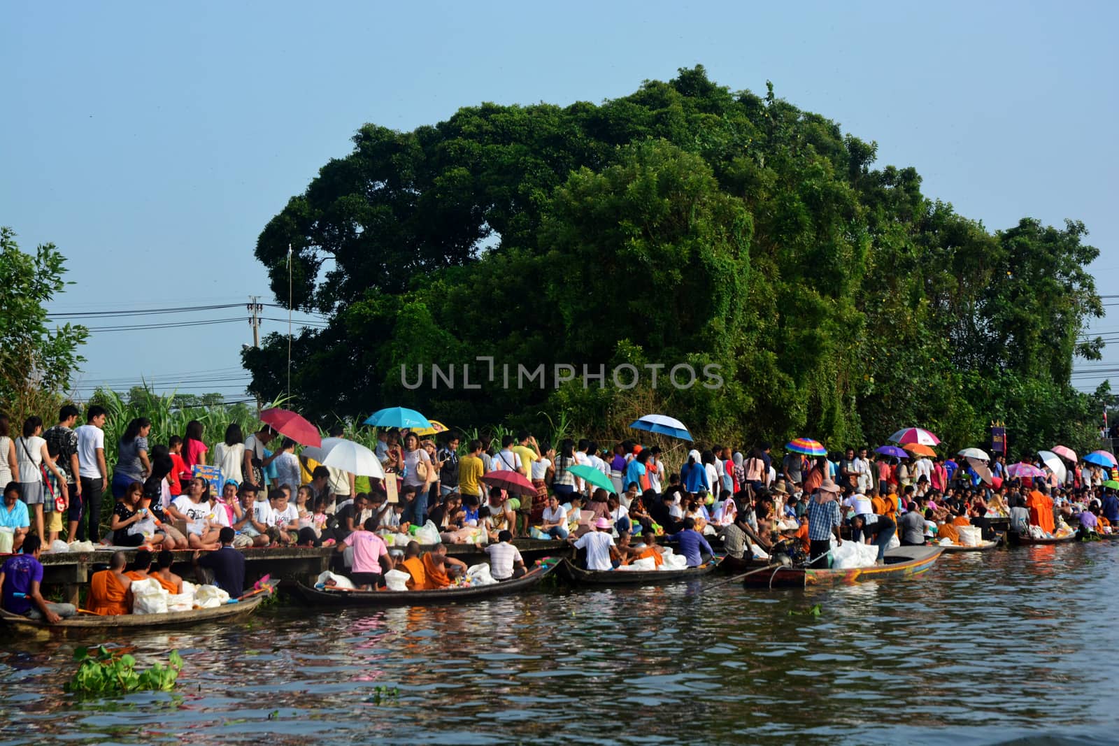 BANGKOK, THAILAND – OCTOBER 8, 2017 : Tuk baat Phra Roi River Festival (Give alms to a Buddhist monk on boat) On the Lamplatiew Canal in front of Wat Sutthaphot, Lat Krabang District Bangkok

