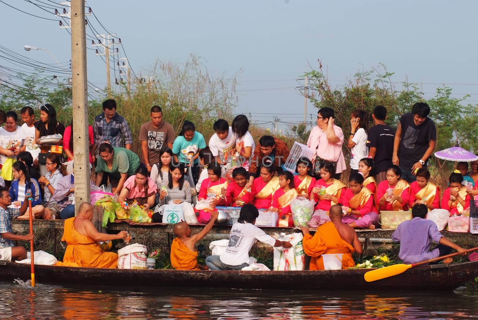 BANGKOK, THAILAND – OCTOBER 8, 2017 : Tuk baat Phra Roi River Festival (Give alms to a Buddhist monk on boat) On the Lamplatiew Canal in front of Wat Sutthaphot, Lat Krabang District Bangkok