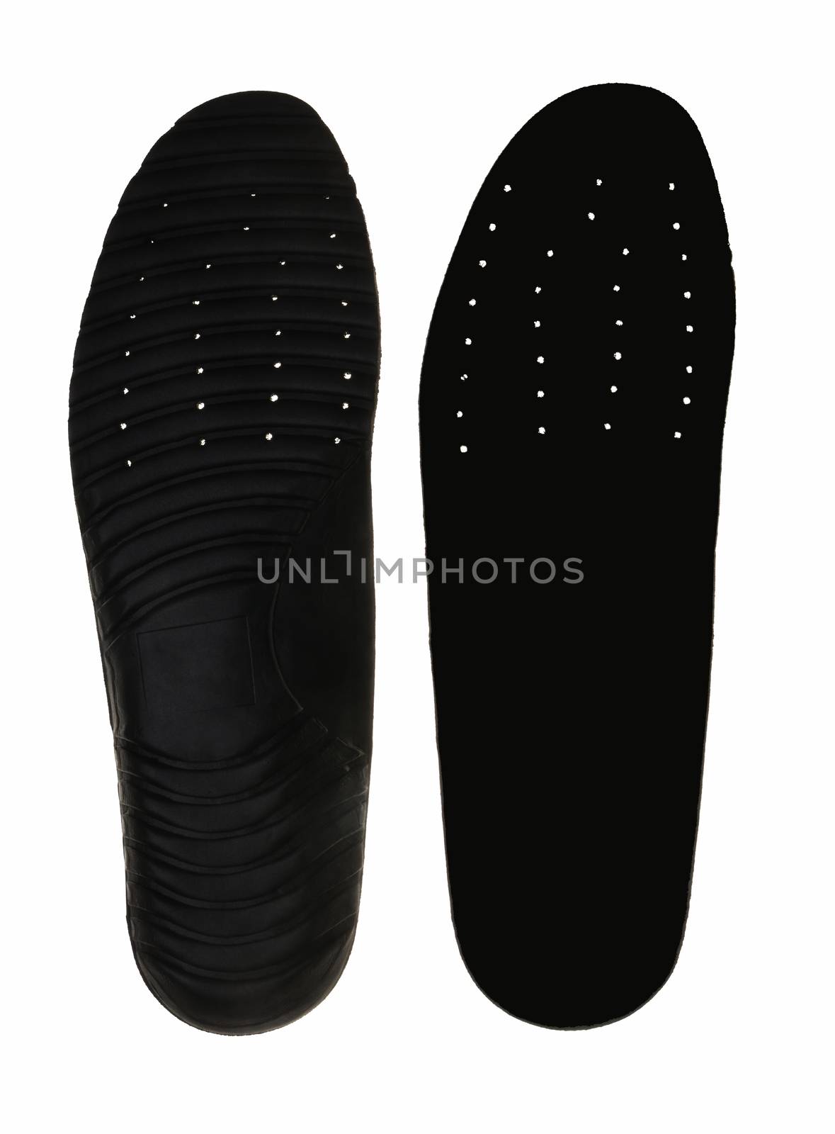 Black insoles for shoes on white background. by ideation90