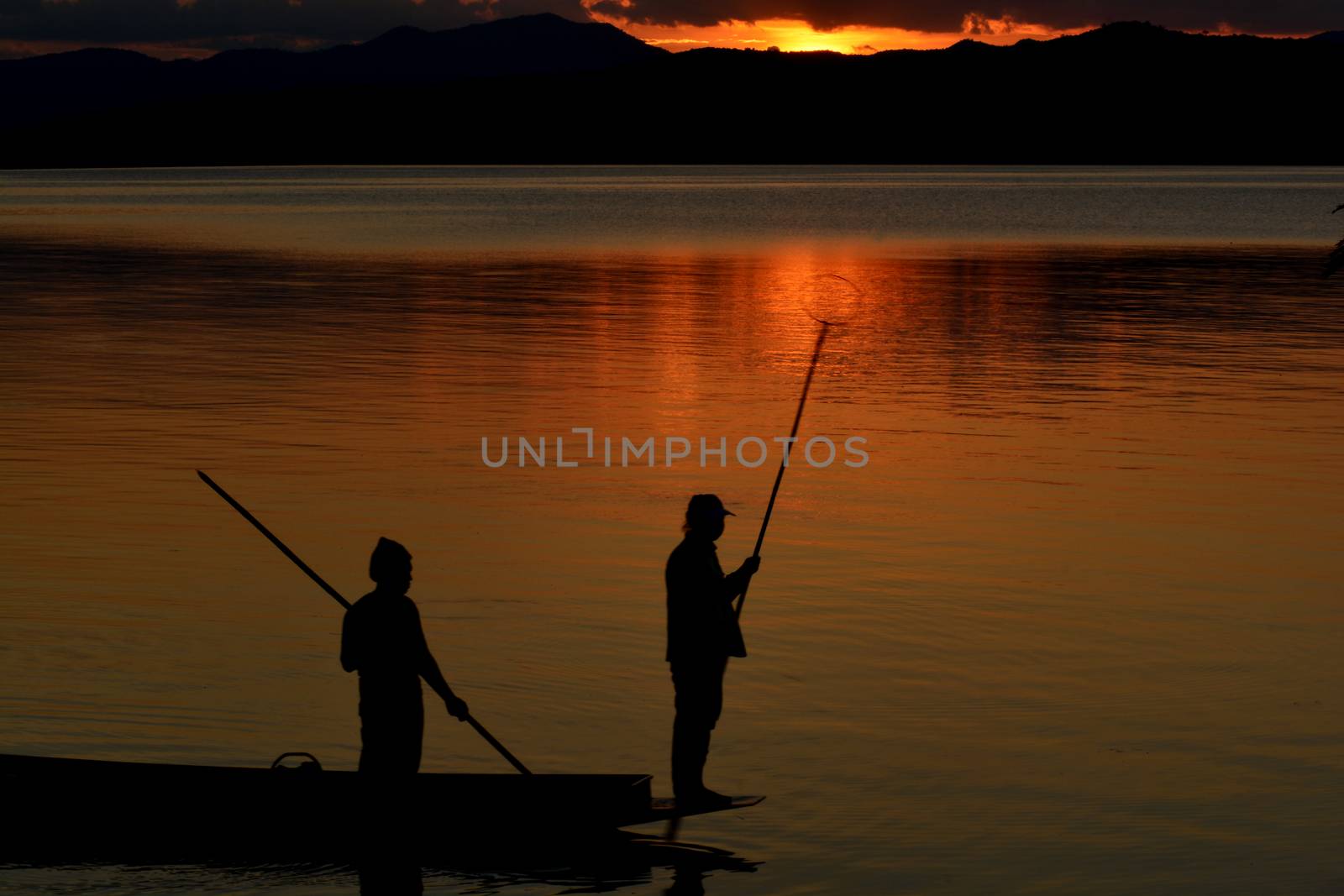 Silhouette of the  beautiful sunset on the boat by ideation90