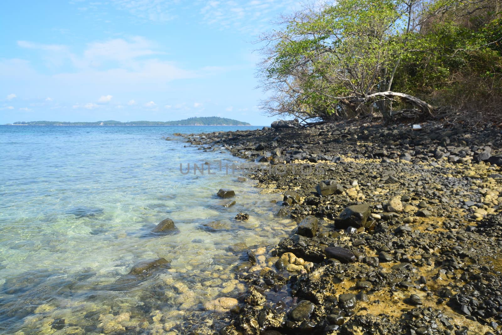 Koh Hin Ngam  is a unique small island unlike other island. It's covered with small black rocks  by ideation90