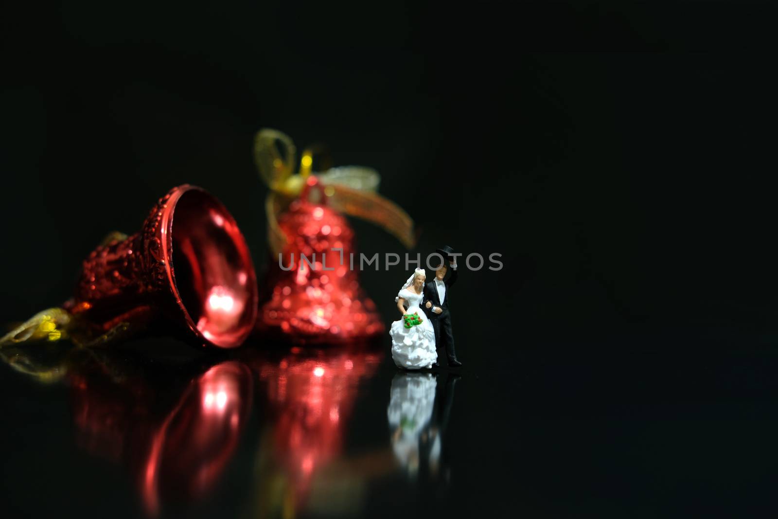 Miniature wedding concept. Bride and groom walking out make greeting after wedding procession. image photo