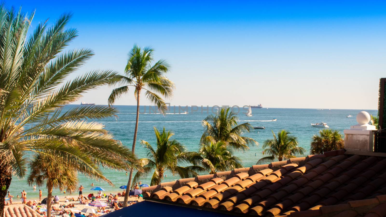 Looking Over a Rooftop at a Beach in a Tropical Location by bju12290