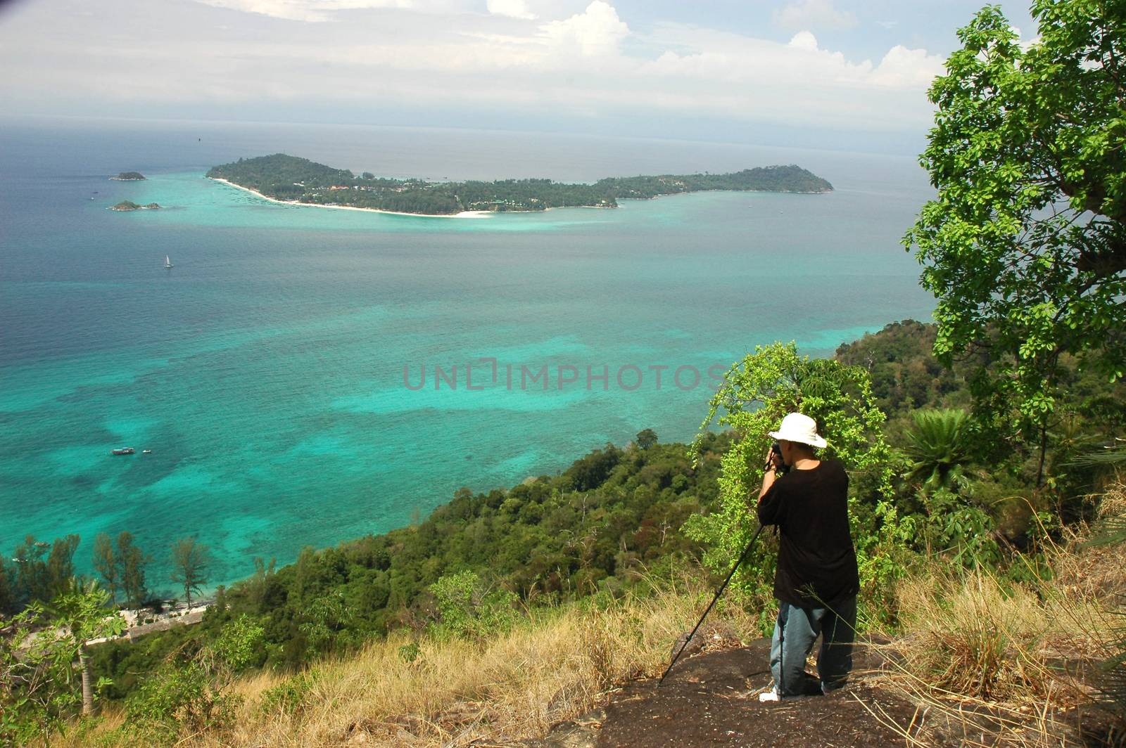 Tourists are taking pictures Top view of Chado Cliff view point on Adang island, From here you can see Koh Lipe