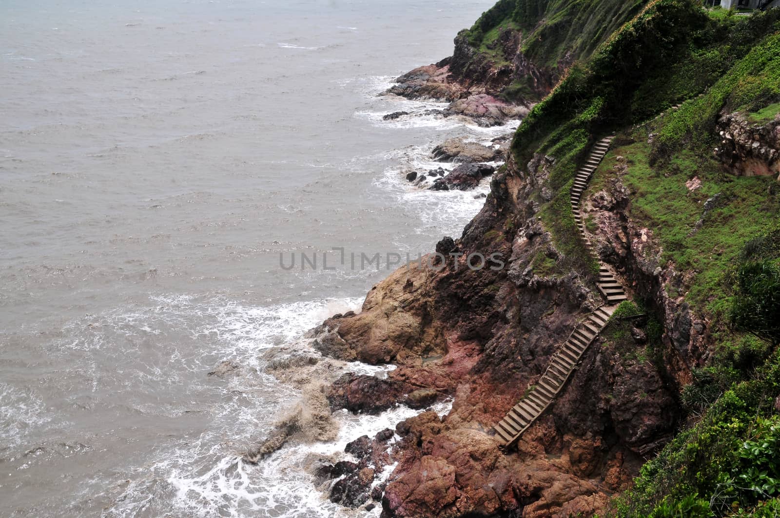 Sea views and mountains with cliffs, old stairs down the cliffs, Perid Island by ideation90