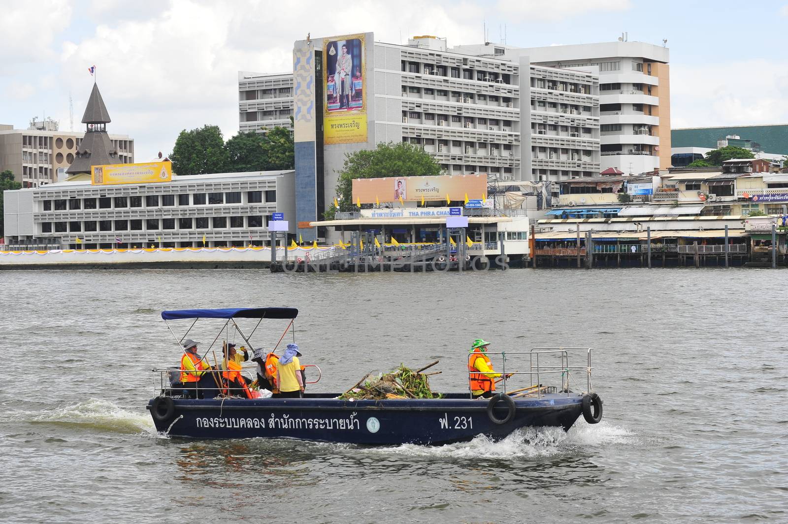 BANGKOK, THAILAND –  21 OCTOBER 2019 : The Canal System Division  Department of Drainage & Sewerage boat  are collecting waste and Aquatic Weed  in  Chao Phraya River