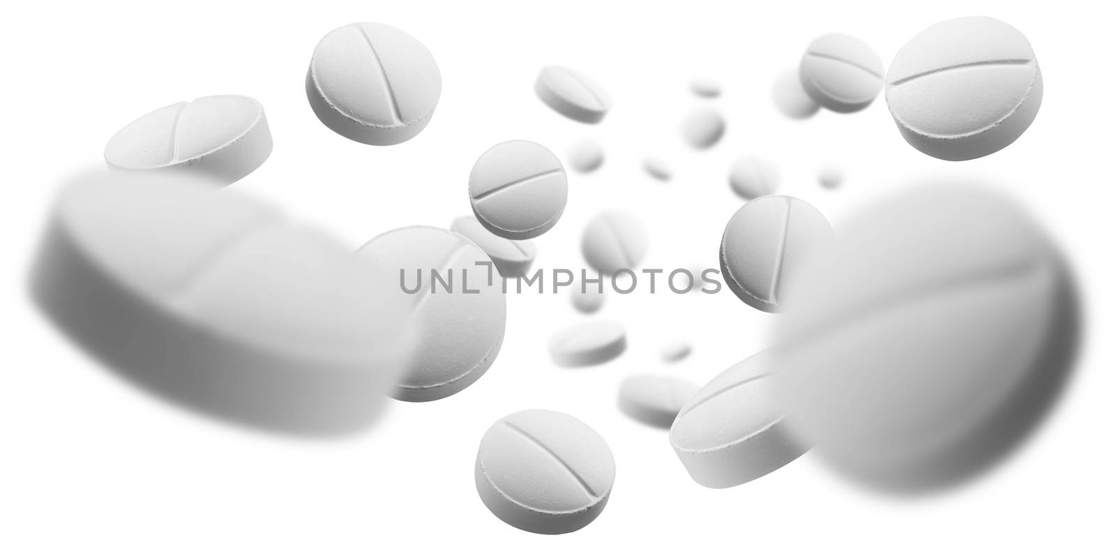 White round tablets levitate on a white background.