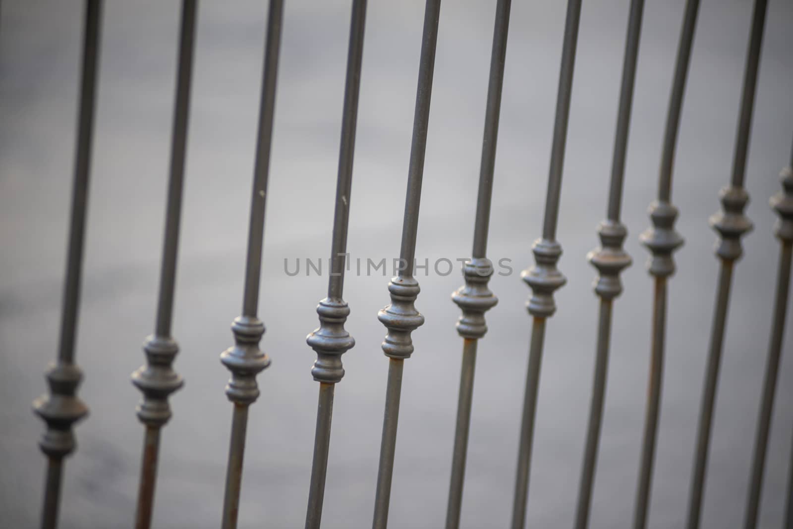 symmetrical detail of an iron railing placed on a balcony