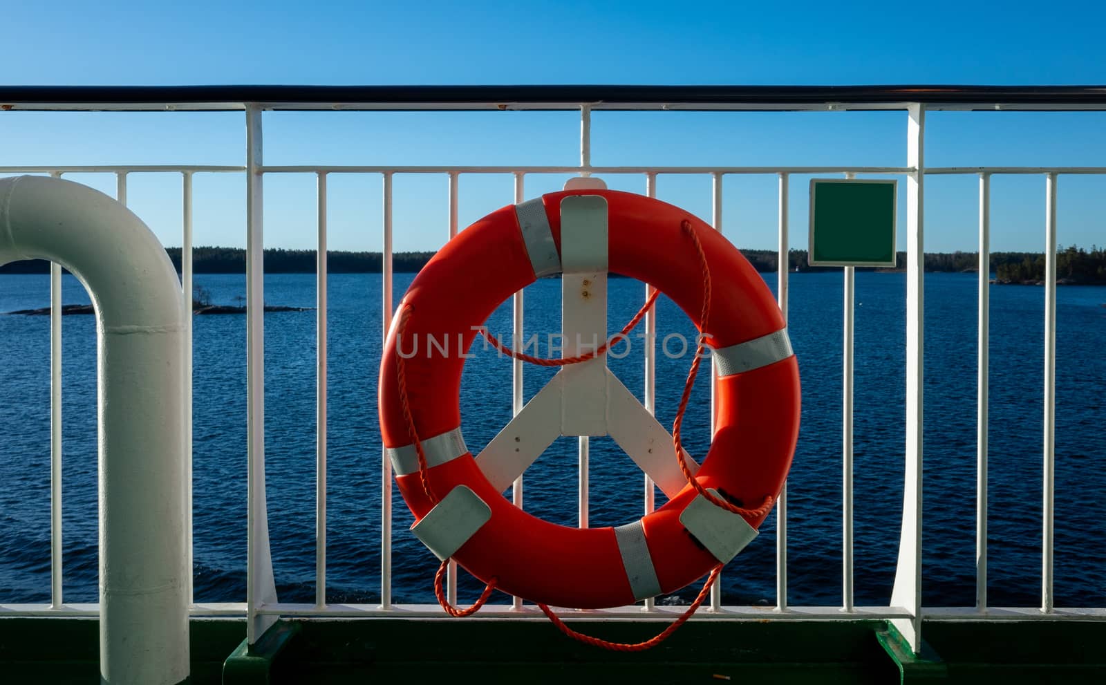 Lifebuoy on the railing of one of the decks of a tourist ferry