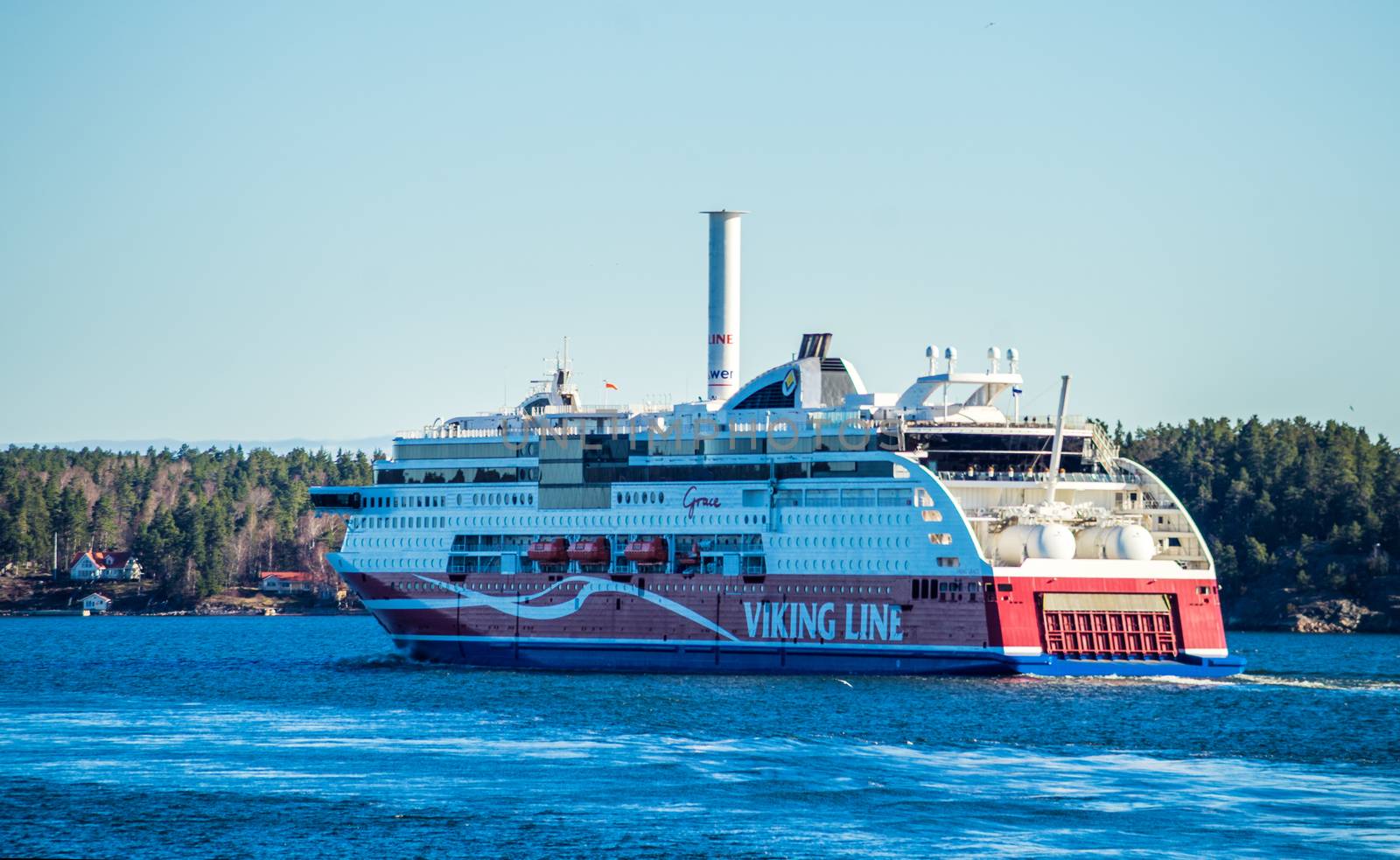 22 April 2019, Stockholm, Sweden. High-speed passenger and car ferry of the Finnish shipping concern Viking Line Viking Grace equipped with rotary sail in Stockholm skerries.