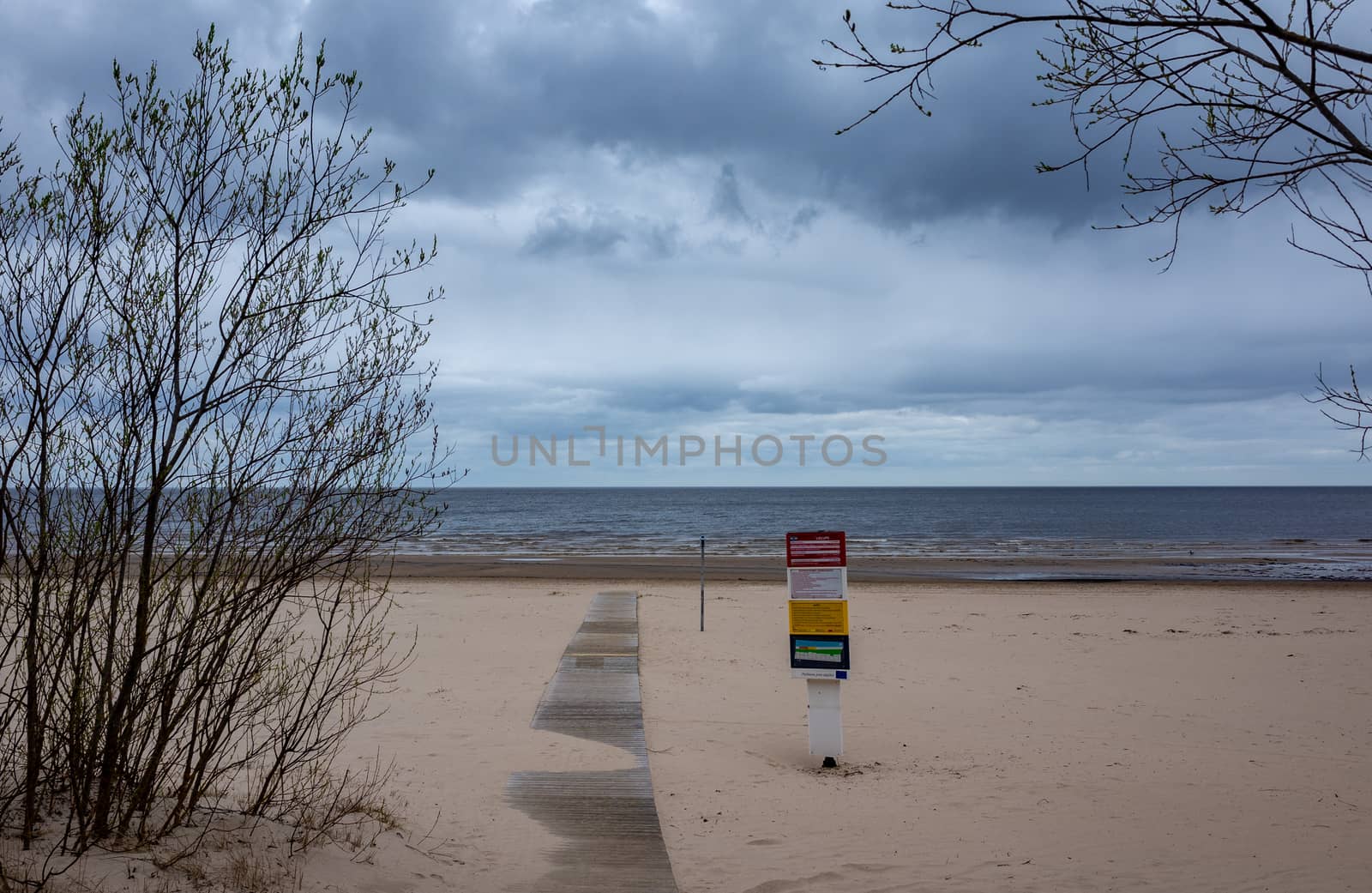 April 25, 2018 Jurmala, Latvia. Wooden walkway on the sandy beach of the Baltic Sea in Jurmala.