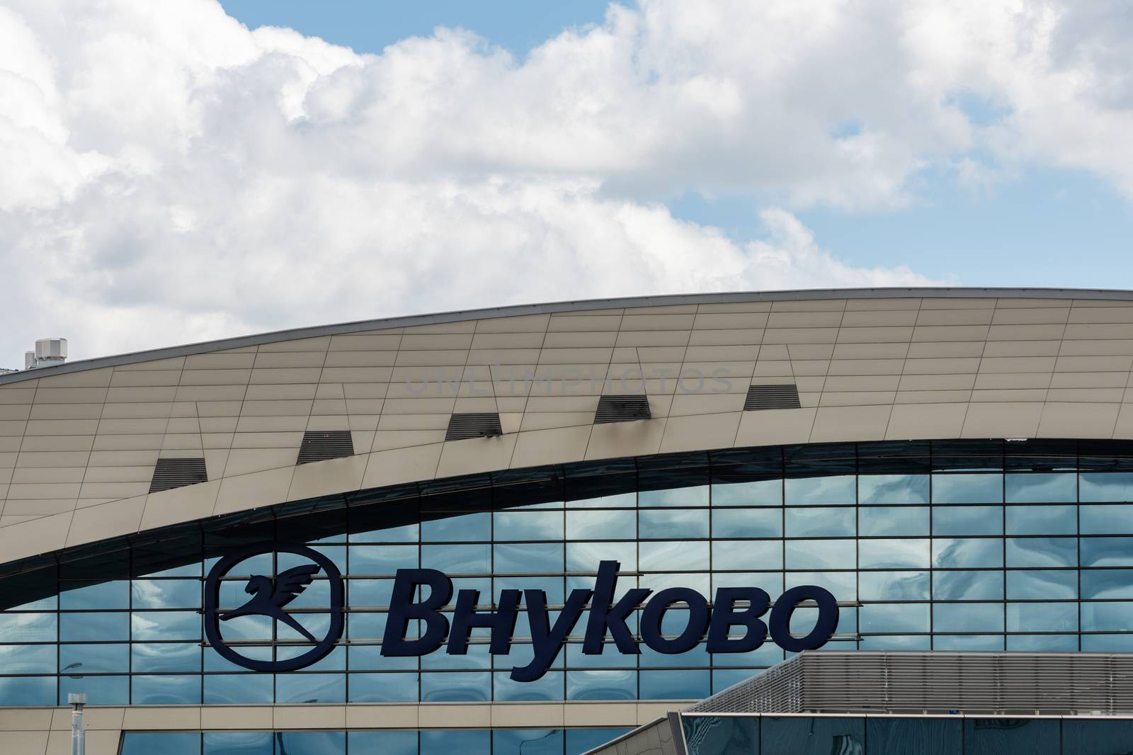 July 2, 2019 Moscow, Russia. Sign on the facade of the terminal of Vnukovo airport in clear sunny weather